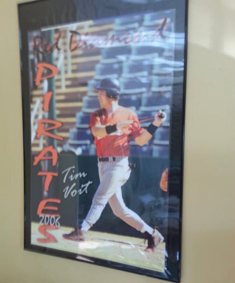 Framed 2006 Philadelphia Phillies baseball poster signed by Tim Voit showing a player mid-swing at bat